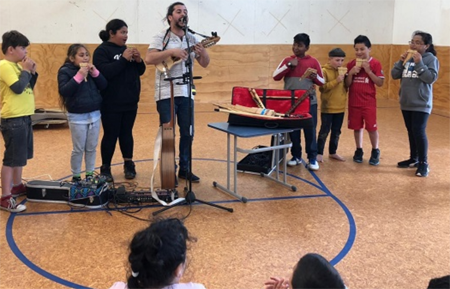 A group performs at Windley School.