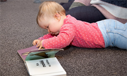 Child looking at book.