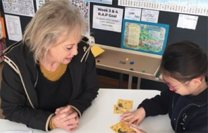 Colleen works with a new learner of English.