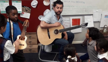 Matias works with children at Holy Family School.