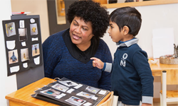 Teacher and student looking at photos.