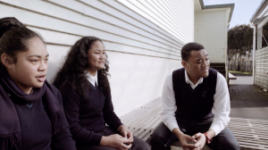 Three students talking.