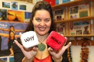 Teacher holding word dice.