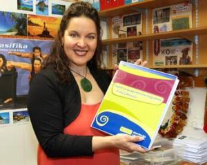 Teacher holding ELLP resource.